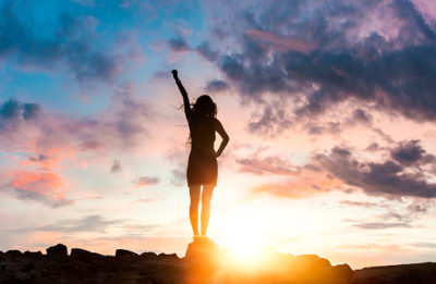 Woman Silhouette at sunset on hill Woman Silhouette at sunset on hill